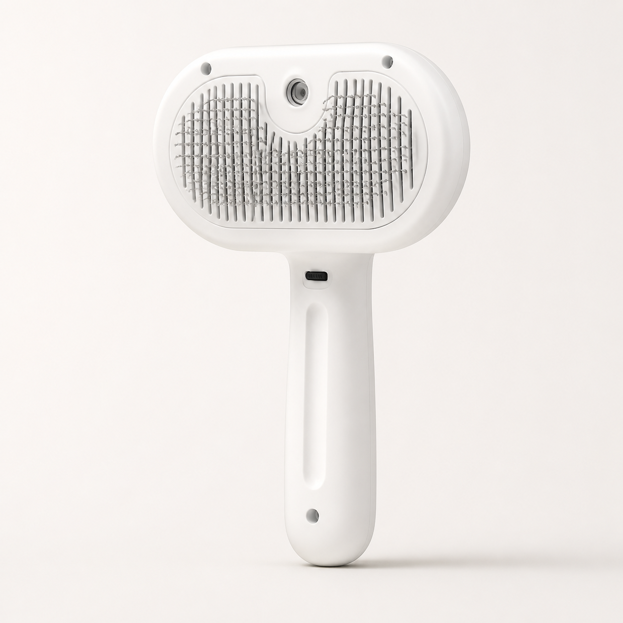 White Arelio MistBrush three-in-one pet grooming brush isolated on white