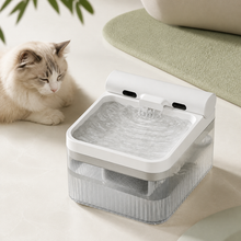 Arelio Flow circulating filtered water beside a resting cat in a calm modern room