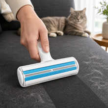 Arelio FurRoll removing pet hair from a charcoal fabric sofa