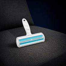 Arelio FurRoll making a broad cleaning pass across a sofa cushion